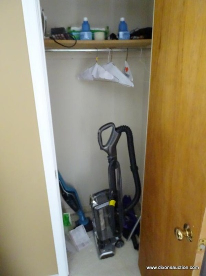 (LR) CLOSET LOT- LOT INCLUDES IRONING BOARD, SHARK VACUUM WITH ATTACHMENTS, BLACK AND DECKER BATTERY
