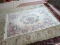 HANDMADE CHINESE SCULPTED AREA RUG IN IVORY, MAUVE AND GREEN. MEASURES APPROXIMATELY 5 FT 7 IN X 9