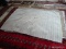 MACHINE MADE GRAY RUG. MEASURES APPROXIMATELY 4 FT 10 IN X 7 FT 9 IN. ITEM IS SOLD AS IS WHERE IS