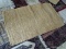 BRAIDED LEATHER RUG. MEASURES APPROXIMATELY 2 FT 6 IN X 4 FT 1 IN. ITEM IS SOLD AS IS WHERE IS WITH
