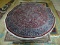 ROUND PERSIAN RUG IN RED, BLUE, AND IVORY. MEASURES APPROXIMATELY 8 FT IN DIA. ITEM IS SOLD AS IS