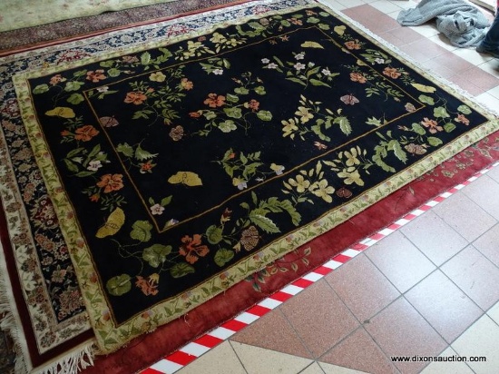 CAPEL MACHINE MADE KALEEN WOOL RUG. MADE IN NEW ZEALAND IN THE FLORAL GARDEN PATTERN. IN NAVY BLUE,
