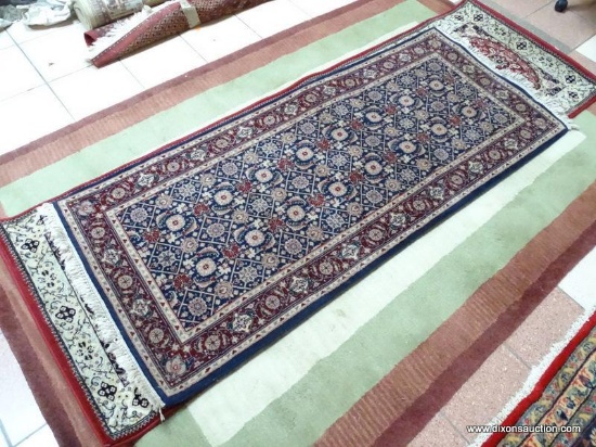 HANDMADE PERSIAN IN BLUE, MAROON, AND IVORY. MEASURES APPROXIMATELY 2 FT 7 IN X 6 FT 4 IN. ITEM IS