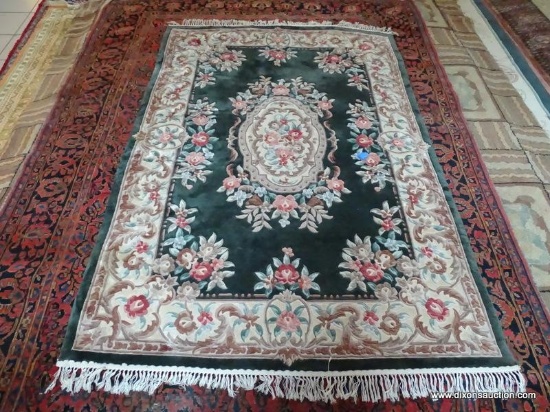 HANDMADE SCULPTED CHINESE RUG IN GREEN, IVORY, AND MAUVE. MEASURES APPROXIMATELY 4 FT 6 IN X 5 FT 7