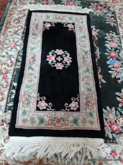ESTATE OWNED HAND KNOTTED CHINESE SCULPTED RUG IN BLACK, IVORY, AND GREEN. MEASURES APPROXIMATELY 5