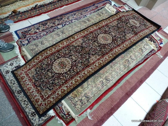MACHINE MADE ISFAHAN IN BLACK, MAROON, AND IVORY. MEASURES 2 FT X 7 FT 7 IN. ITEM IS SOLD AS IS