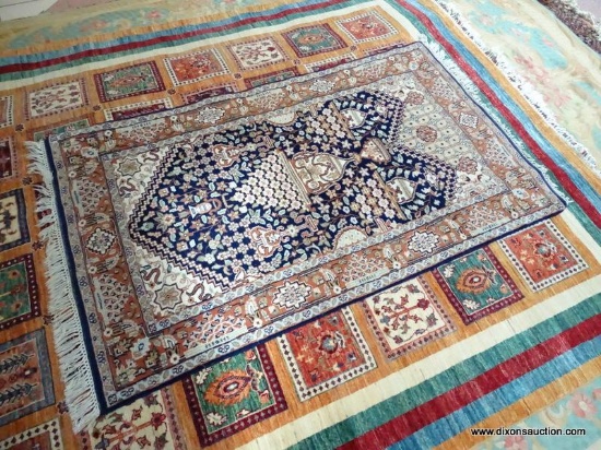 HANDMADE PERSIAN IN BLUE, IVORY AND BROWN. MEASURES APPROXIMATELY 3 FT 1 IN X 5 FT 7 IN. ITEM IS