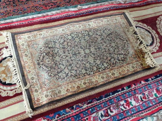 MACHINE MADE ORIENTAL STYLE RUG IN BROWN, RUST, AND IVORY. SHOWS WEAR. MEASURES APPROXIMATE 2 FT 2