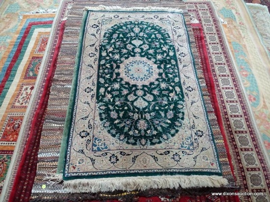 HAND KNOTTED FINELY WOVEN PERSIAN IN GREEN, IVORY, AND BLUE. MEASURES APPROXIMATELY 3 FT X 5 FT 2