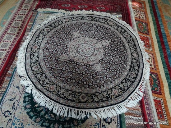 HAND KNOTTED ROUND PERSIAN IN BLACK, IVORY, AND SAGE. MEASURES 4 FT 2 IN DIA. ITEM IS SOLD AS IS