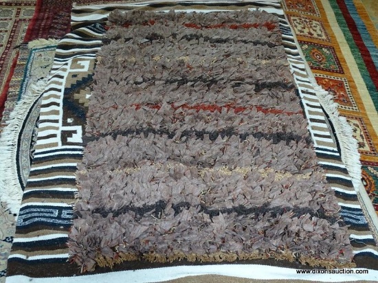 BARNSIDE QUILT BRAIDED RUG IN BROWN, RUST, AND BEIGE. MEASURES APPROXIMATELY 2 FT 7 IN X 4 FT 10 IN.