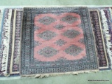 HANDMADE BOKHARA IN BEIGE, MAUVE, AND BLACK. MEASURES APPROXIMATELY 3 FT 1 IN X 3 FT 1 IN. ITEM IS