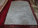 MACHINE MADE ACCENT RUG IN GRAY, WHITE, AND BROWN. MEASURES APPROXIMATELY 5 FT 2 IN X 7 FT 2 IN.