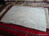 MACHINE MADE GRAY RUG. MEASURES APPROXIMATELY 4 FT 10 IN X 7 FT 9 IN. ITEM IS SOLD AS IS WHERE IS