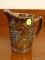 (DR) INTERNATIONAL GLASS CARNIVAL GLASS PITCHER IN THE GRAPE PATTERN- 6 IN H, ITEM IS SOLD AS IS