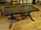 (LR) MAHOGANY DUNCAN PHYFE STYLE COFFEE TABLE WITH BRASS PAW FEET- 36 IN X 18 IN X 17 IN, VERY GOOD