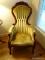 (LR) MAHOGANY VICTORIAN STYLE ROSE CARVED GENTLEMAN'S CHAIR IN GREEN VELVET- 26 IN X 24 IN X 47 IN-