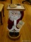 (LR) REMOTE CONTROL SERVING SANTA- 23 IN H, ITEM IS SOLD AS IS WHERE IS WITH NO GUARANTEES OR