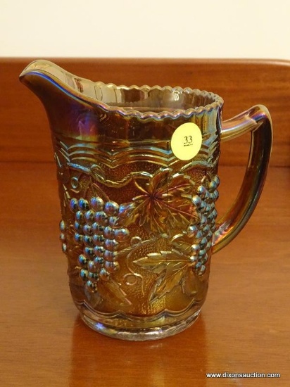 (DR) INTERNATIONAL GLASS CARNIVAL GLASS PITCHER IN THE GRAPE PATTERN- 6 IN H, ITEM IS SOLD AS IS
