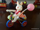 (BD2) VINTAGE METAL ROLLING RABBIT ON TRIKE- 5 IN H, ITEM IS SOLD AS IS WHERE IS WITH NO GUARANTEES