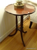 (LR) ONE OF A PR. OF MAHOGANY DUNCAN PHYFE PIE CRUST TABLES WITH BRASS PAW FEET- VERY CLEAN AND