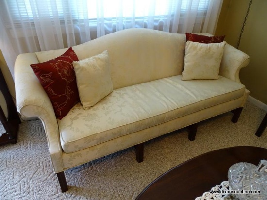 (FR) CREAM COLORED UPHOLSTERED CAMEL BACK SOFA WITH BLOCK LEGS. MEASURES APPROX. 80" X 32" X 33"