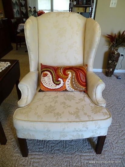 (FR) CREAM COLORED UPHOLSTERED WINGBACK CHAIR WITH BLOCK LEGS. MEASURES APPROX. 29" X 27" X 33".