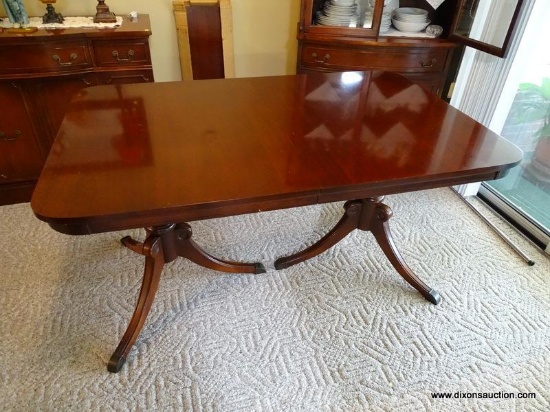 (DR) MAHOGANY DOUBLE PEDESTAL DROP LEAF DINING TABLE WITH RASS CAPPED FEET. MEASURES 56" X 36" X