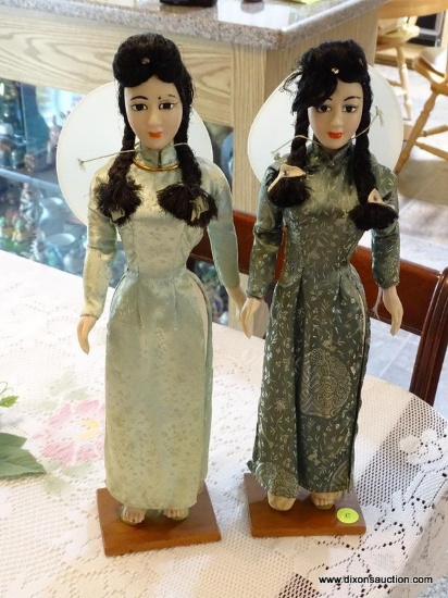 (DR) PAIR OF ASIAN FEMALE FIGURINES. EACH MEASURES 17" TALL AND STANDS ON SQUARE WOOD BASE.