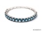 .925 STERLING SILVER LADIES 20 CT BLUE TOPAZ BANGLE BRACELET. ITEM IS SOLD AS IS WHERE IS WITH NO