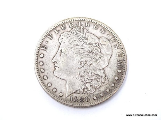 1886-O EXTRA FINE MORGAN SILVER DOLLAR. ITEM IS SOLD AS IS WHERE IS WITH NO GUARANTEES OR WARRANTY.