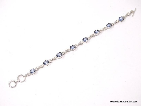 .925 STERLING SILVER LADIES 8 CT BLUE TOPAZ TENNIS BRACELET. ITEM IS SOLD AS IS WHERE IS WITH NO