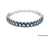 .925 STERLING SILVER LADIES 16 CT BLUE TOPAZ BANGLE. ITEM IS SOLD AS IS WHERE IS WITH NO GUARANTEES