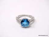 .925 STERLING SILVER LADIES 4-1/2 CT BLUE TOPAZ RING. SIZE 8. ITEM IS SOLD AS IS WHERE IS WITH NO