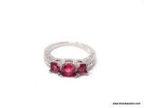 .925 STERLING SILVER LADIES 2 CT GARNET RING. SIZE 8. ITEM IS SOLD AS IS WHERE IS WITH NO GUARANTEES