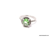 .925 STERLING SILVER LADIES 2 CT PERIDOT RING. SIZE 8. ITEM IS SOLD AS IS WHERE IS WITH NO