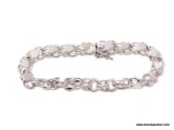 .925 STERLING SILVER LADIES 1950'S ERA HEAVY CHARM BRACELET. ITEM IS SOLD AS IS WHERE IS WITH NO