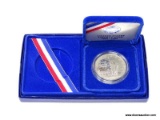 1986 S PROOF ELLIS ISLAND COMMEMORATIVE. ITEM IS SOLD AS IS WHERE IS WITH NO GUARANTEES OR WARRANTY.