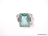 .925 STERLING SILVER LADIES 6 CT BLUE TOPAZ RING. SIZE 8. ITEM IS SOLD AS IS WHERE IS WITH NO