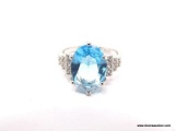 .925 STERLING SILVER LADIES 5 CT BLUE TOPAZ RING SIZE 8. ITEM IS SOLD AS IS WHERE IS WITH NO