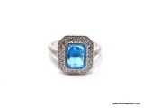 .925 STERLING SILVER LADIES 2-1/2 CT BLUE TOPAZ RING. SIZE 8. ITEM IS SOLD AS IS WHERE IS WITH NO