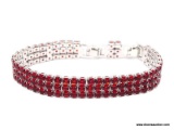 .925 STERLING SILVER LADIES 19 CT GARNET BRACELET. ITEM IS SOLD AS IS WHERE IS WITH NO GUARANTEES OR