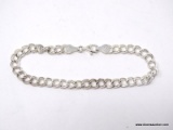 .925 STERLING SILVER LADIES VINTAGE CHARM BRACELET. ITEM IS SOLD AS IS WHERE IS WITH NO GUARANTEES