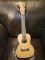 (BAY 7) LOHANU 4 STRING UKULELE. HAS SOME DAMAGE TO THE NECK. ITEM IS SOLD AS IS WHERE IS WITH NO