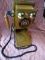 (BAY 7) ANTIQUE LOOK PUSH BUTTON PHONE WITH OAK CASE AND LOWER STORAGE AREA. ITEM IS SOLD AS IS