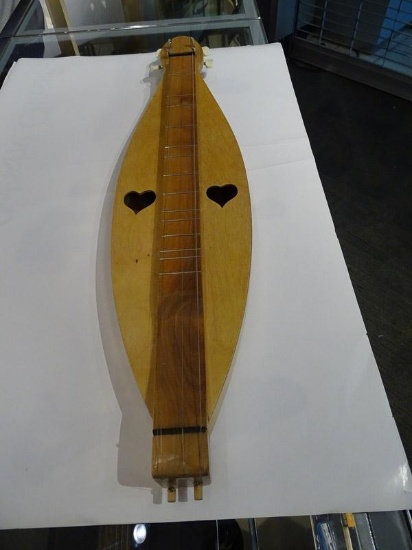 (SC) DULCIMER FACTORY 4 STRING DULCIMER WITH HEART SHAPED CUTOUT HOLES. ITEM IS SOLD AS IS WHERE IS
