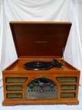 (BAY 7) CROSLEY AM/FM RADIO WITH CD PLAYER, CASSETTE DECK, AND TURNTABLE IN WOODEN CASE. ITEM IS