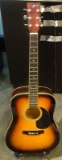 (SC) JAY JR. ACOUSTIC ELECTRIC GUITAR. NEEDS STRINGS, PEGS, AND LOWER TENSION BAR. MODEL