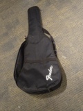 (SC) FENDER SOFT CASE GUITAR CARRYING BAG. ALSO INCLUDES A GUITAR LEARNING BOOK. ITEM IS SOLD AS IS