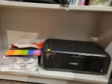 (BAY 7) CANON PRINTER/SCANNER/COPIER WITH PRINTING PAPER AND POWER CORD. ITEM IS SOLD AS IS WHERE IS